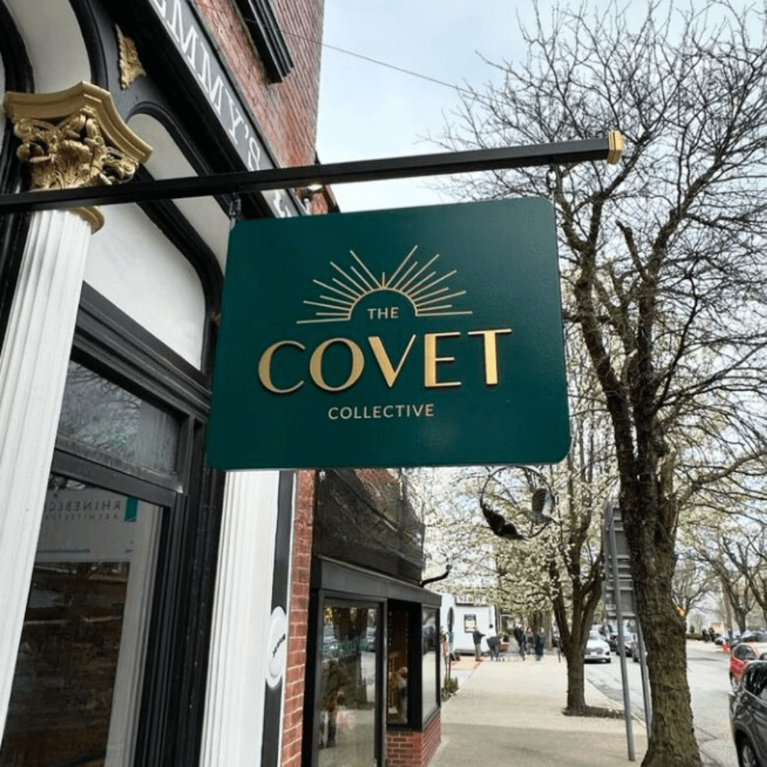 the covet collective outside sign